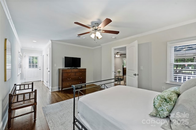 bedroom with ornamental molding, dark wood-style floors, baseboards, and a ceiling fan