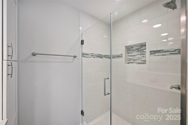 bathroom with a shower stall
