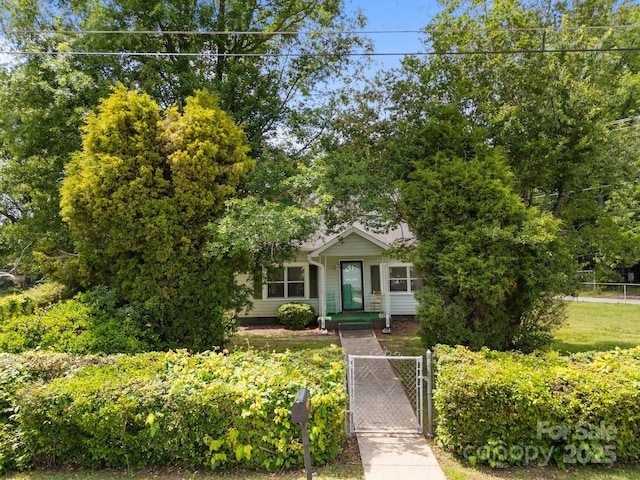 obstructed view of property with a gate and crawl space