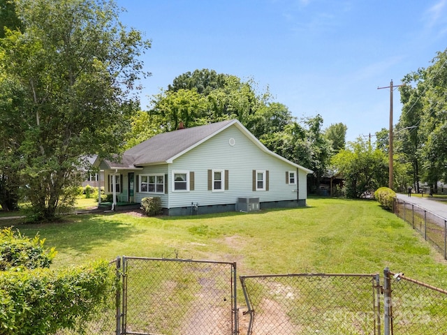 back of house with a gate, crawl space, and cooling unit