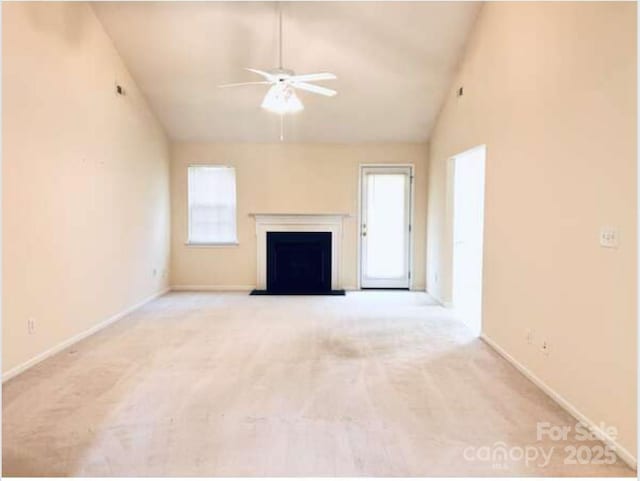 318 Linsbury Ct, Gastonia, NC 28056 - unfurnished living room with ceiling fan, carpet floors, baseboards, a fireplace, and high vaulted ceiling
