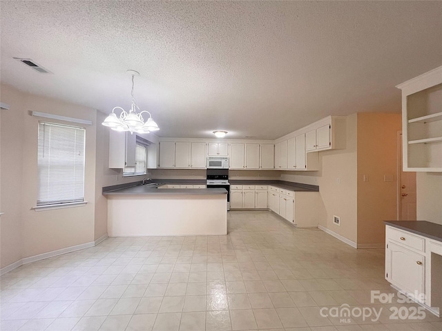 318 Linsbury Ct, Gastonia, NC 28056 - kitchen featuring white microwave, range with electric stovetop, a peninsula, a textured ceiling, and baseboards