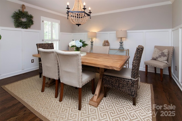 1208 Chausley Ct, Charlotte, NC 28211 - dining room with a chandelier, a decorative wall, dark wood-style flooring, crown molding, and a wainscoted wall