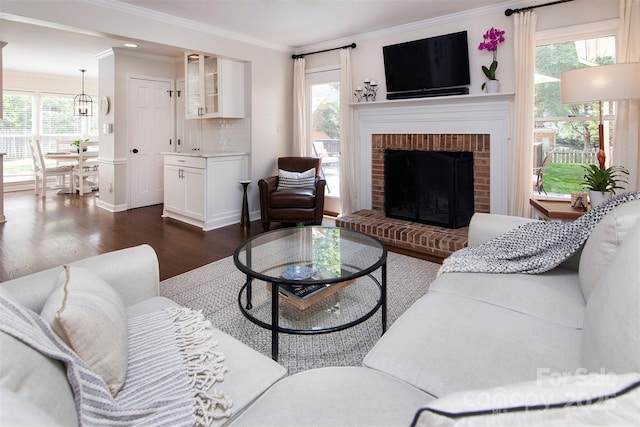 1208 Chausley Ct, Charlotte, NC 28211 - living room featuring dark wood finished floors, crown molding, a fireplace, and baseboards