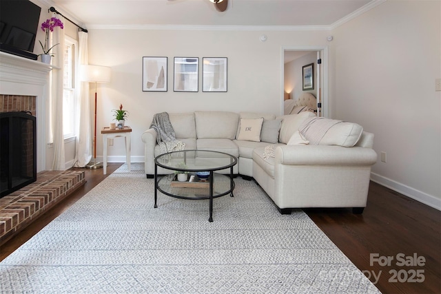 1208 Chausley Ct, Charlotte, NC 28211 - living room featuring baseboards, dark wood-style floors, crown molding, and a brick fireplace