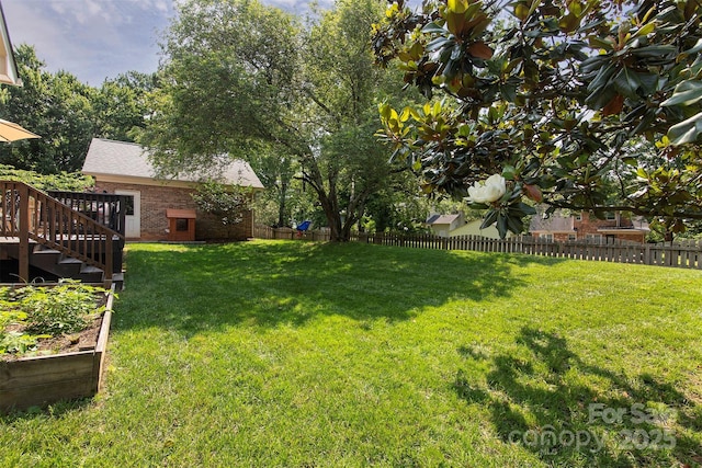 1208 Chausley Ct, Charlotte, NC 28211 - view of yard with a vegetable garden and a deck