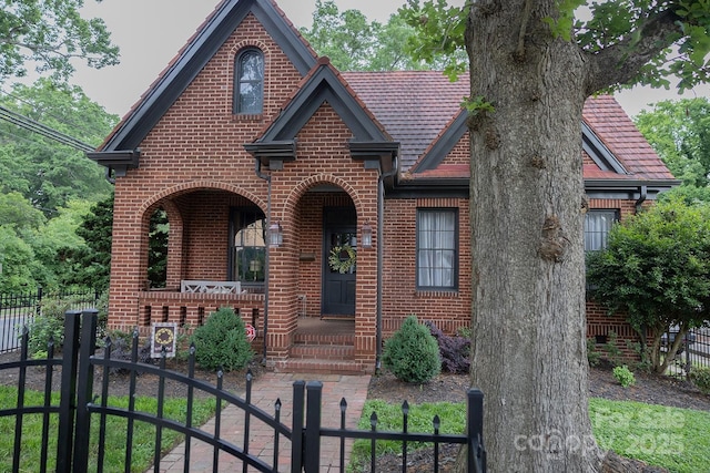 324 N 5th St, Albemarle, NC 28001 - tudor home with brick siding and a gate