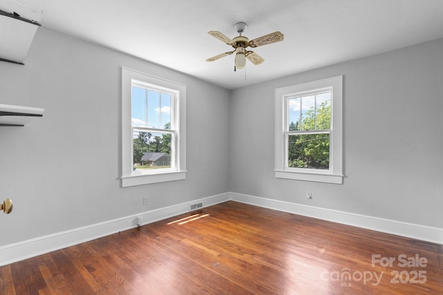 2336 32nd St NE, Hickory, NC 28601 - spare room featuring baseboards, wood finished floors, and a ceiling fan