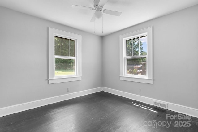 2336 32nd St NE, Hickory, NC 28601 - empty room with dark wood-type flooring, baseboards, and a ceiling fan