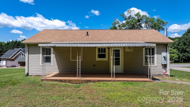 2336 32nd St NE, Hickory, NC 28601 - rear view of house with a lawn, a patio area, and a shingled roof