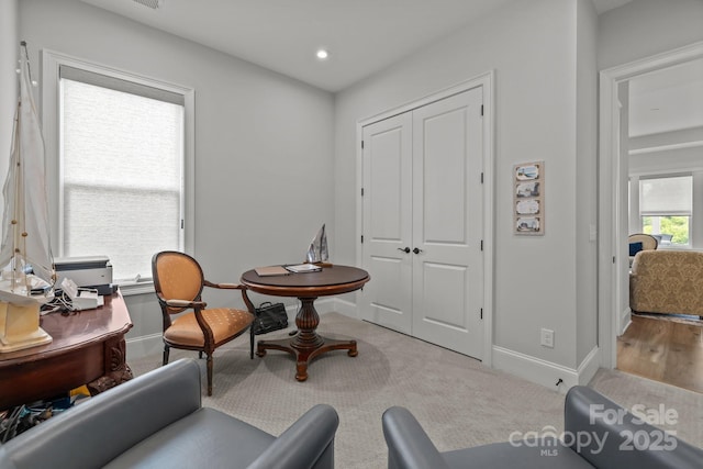 living area with baseboards, carpet floors, and recessed lighting