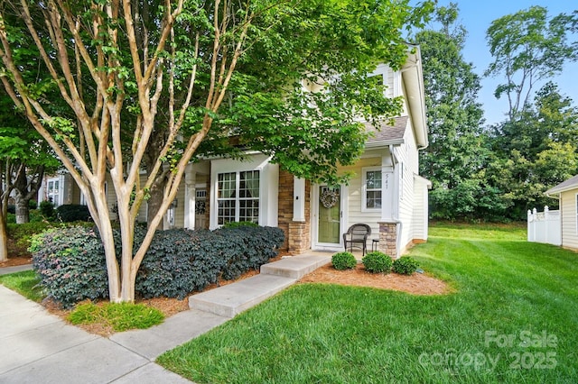 541 River Park Rd, Belmont, NC 28012 - obstructed view of property featuring a front lawn, stone siding, and a shingled roof