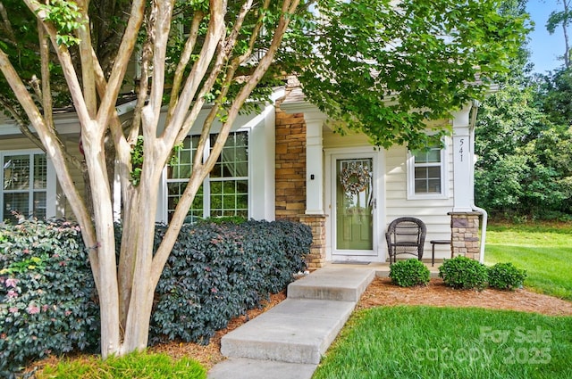 541 River Park Rd, Belmont, NC 28012 - view of front of home featuring stone siding, a porch, and a front yard