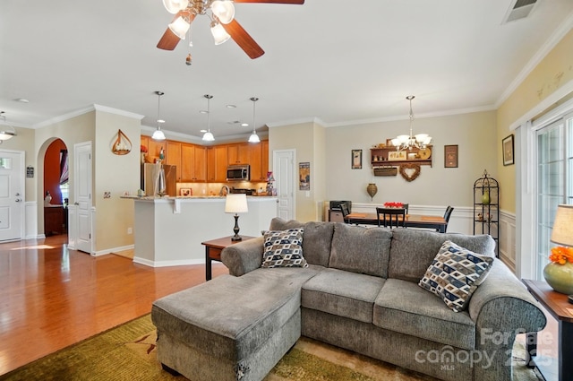 541 River Park Rd, Belmont, NC 28012 - living area with wood finished floors, arched walkways, ceiling fan, a chandelier, and ornamental molding