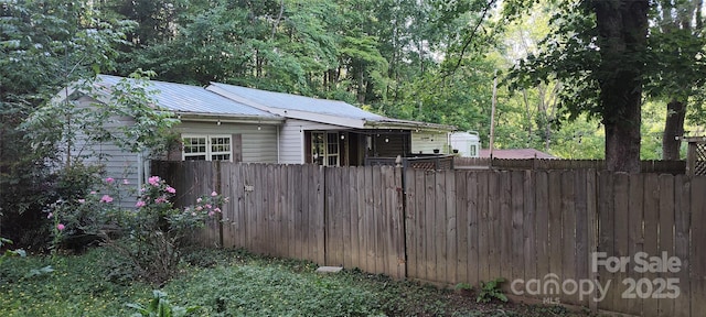 7881 Us-25/70 Hwy, Marshall, NC 28753 - view of side of property with metal roof and a wooded view