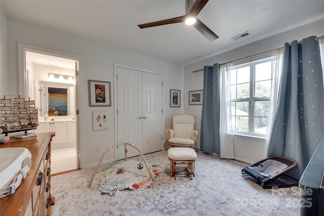 bedroom with ceiling fan, a closet, and baseboards