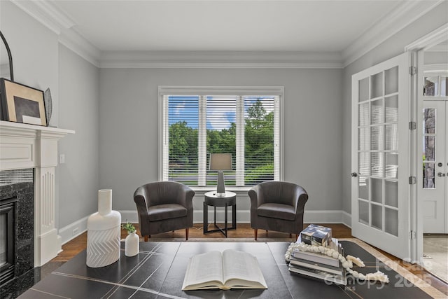 9831 Sedgefield Dr, Waxhaw, NC 28173 - living area featuring a high end fireplace, crown molding, baseboards, and wood finished floors