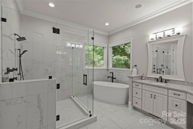 9831 Sedgefield Dr, Waxhaw, NC 28173 - bathroom featuring marble look tile flooring, a shower stall, ornamental molding, a soaking tub, and vanity