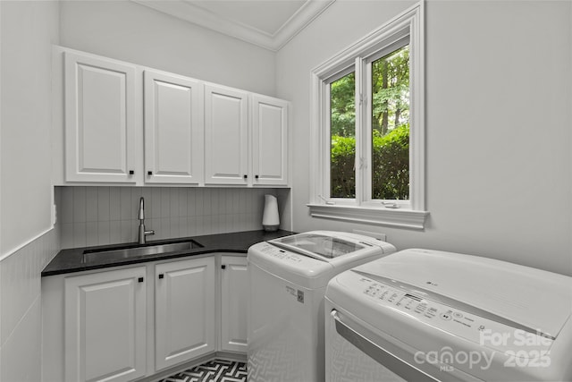 9831 Sedgefield Dr, Waxhaw, NC 28173 - washroom featuring cabinet space, separate washer and dryer, and crown molding