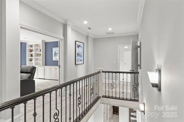 9831 Sedgefield Dr, Waxhaw, NC 28173 - corridor featuring ornamental molding, an upstairs landing, recessed lighting, and built in shelves