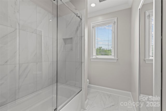 9831 Sedgefield Dr, Waxhaw, NC 28173 - bathroom featuring toilet, marble look tiles, baseboards, and shower / bath combination with glass door