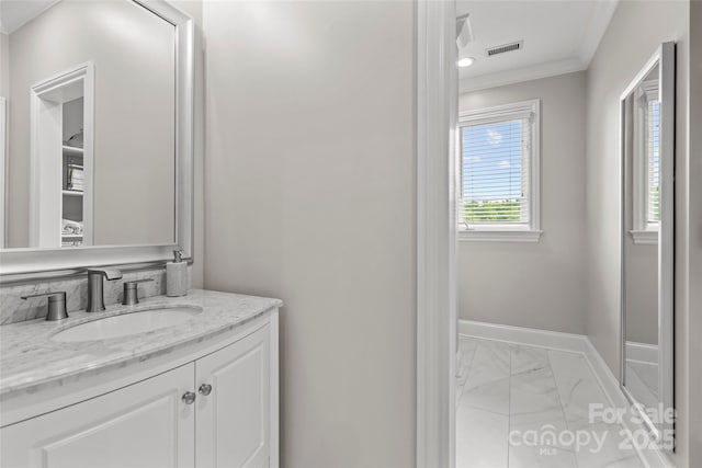 9831 Sedgefield Dr, Waxhaw, NC 28173 - bathroom with marble finish flooring, crown molding, vanity, and baseboards