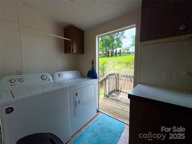 19 Harkins Ln, Marshall, NC 28753 - laundry room with washing machine and dryer, cabinet space, and a textured ceiling