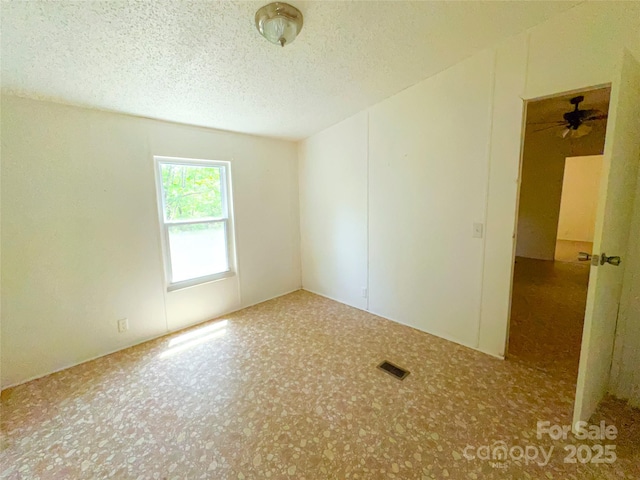 19 Harkins Ln, Marshall, NC 28753 - empty room with a ceiling fan and a textured ceiling