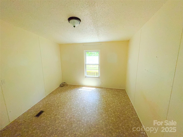 19 Harkins Ln, Marshall, NC 28753 - spare room featuring a textured ceiling