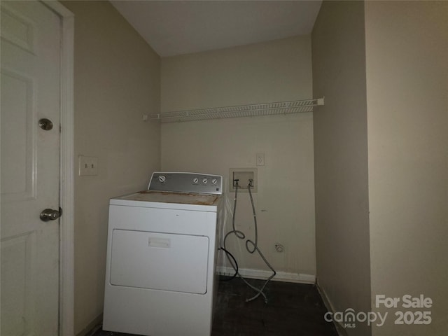 washroom featuring washer / clothes dryer and baseboards
