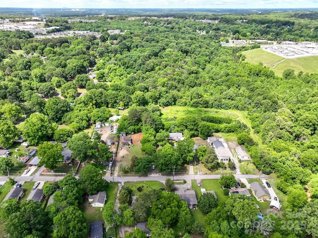 84 Sumner Ave NW, Concord, NC 28027 - aerial overview of property's location with a heavily wooded area