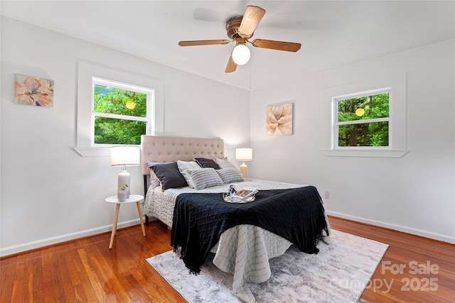 2401 Woodleaf Dr, Gastonia, NC 28052 - bedroom with baseboards, wood finished floors, and ceiling fan