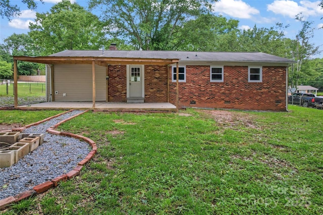 2401 Woodleaf Dr, Gastonia, NC 28052 - view of front of house featuring a patio, a chimney, brick siding, and crawl space