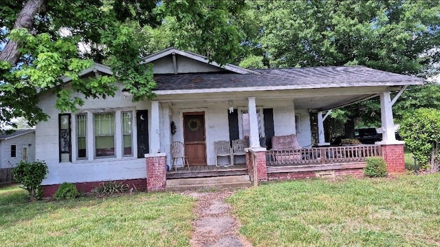 1313 Maiden Rd E, Maiden, NC 28650 - bungalow-style home featuring covered porch, a front lawn, and roof with shingles