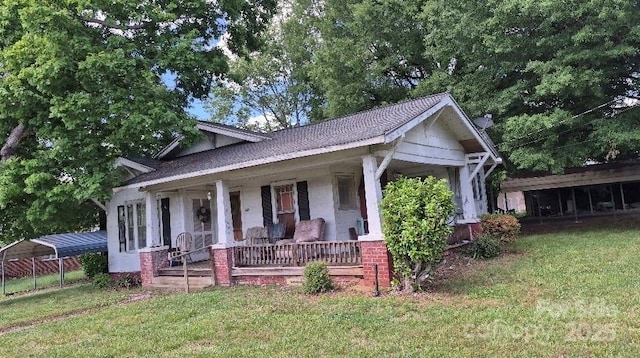 1313 Maiden Rd E, Maiden, NC 28650 - bungalow-style house with covered porch, a front yard, and a detached carport