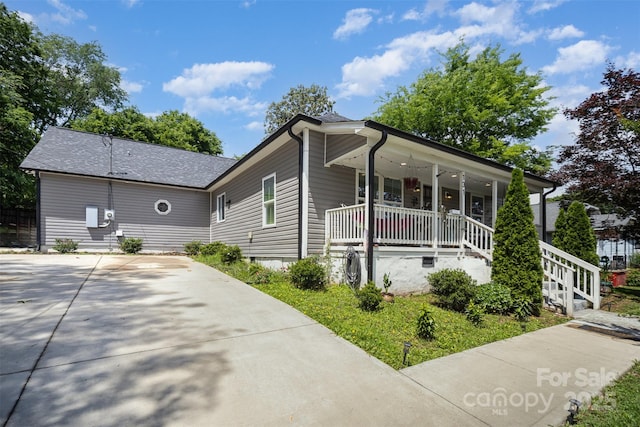 131 Swink St SW, Concord, NC 28027 - view of front facade with a porch and roof with shingles