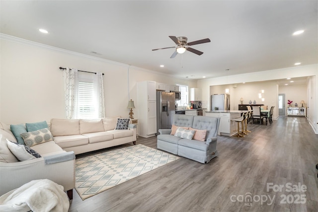 131 Swink St SW, Concord, NC 28027 - living area featuring a ceiling fan, ornamental molding, dark wood-type flooring, recessed lighting, and baseboards
