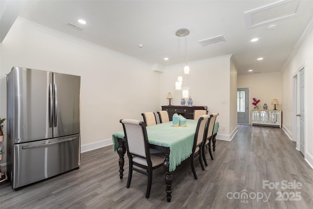 131 Swink St SW, Concord, NC 28027 - dining space featuring dark wood-style flooring, ornamental molding, baseboards, and recessed lighting