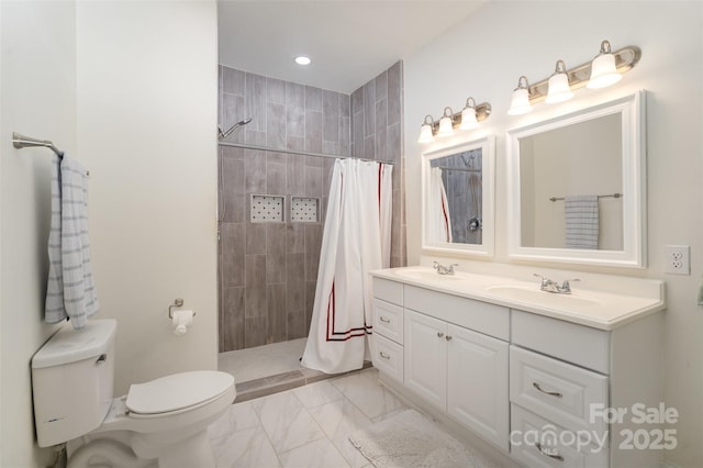 131 Swink St SW, Concord, NC 28027 - bathroom with marble look tiles, toilet, a tile shower, double vanity, and recessed lighting