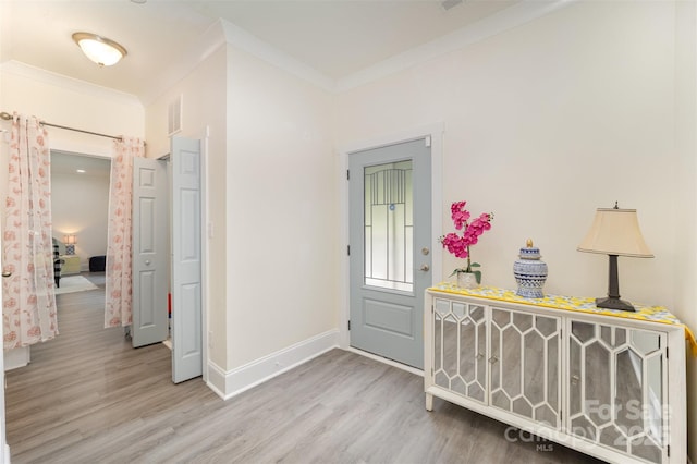 131 Swink St SW, Concord, NC 28027 - foyer featuring ornamental molding, wood finished floors, and baseboards