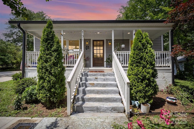 131 Swink St SW, Concord, NC 28027 - view of front of house featuring covered porch and stairs