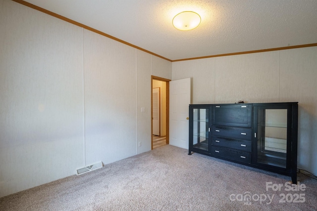 3823 Silver Creek Ter, Morganton, NC 28655 - unfurnished bedroom with carpet floors, crown molding, and a textured ceiling