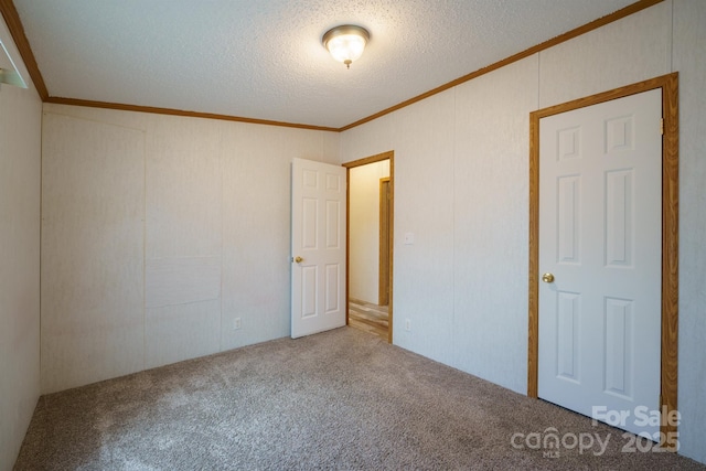 3823 Silver Creek Ter, Morganton, NC 28655 - unfurnished bedroom featuring ornamental molding, carpet, and a textured ceiling
