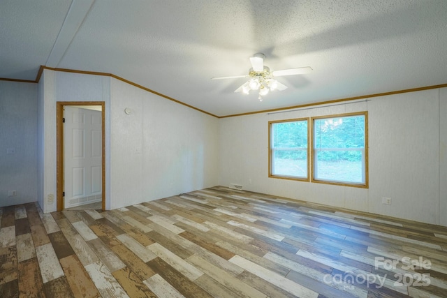3823 Silver Creek Ter, Morganton, NC 28655 - unfurnished room featuring crown molding, wood finished floors, ceiling fan, and a textured ceiling