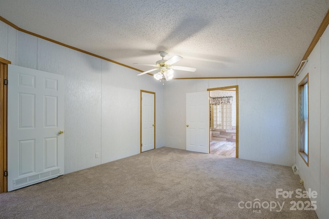 3823 Silver Creek Ter, Morganton, NC 28655 - unfurnished bedroom with ornamental molding, carpet floors, a textured ceiling, ceiling fan, and connected bathroom