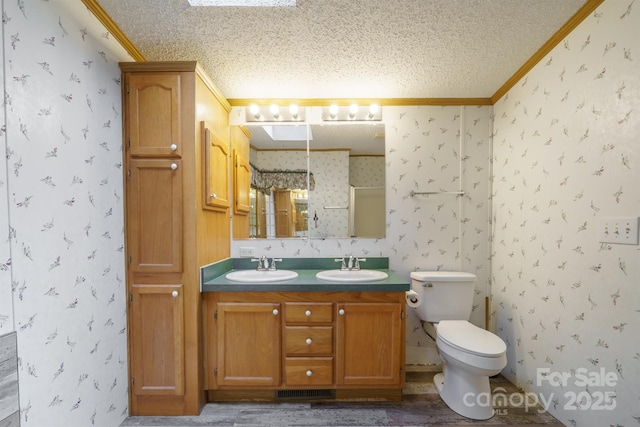 3823 Silver Creek Ter, Morganton, NC 28655 - bathroom featuring crown molding, wallpapered walls, a textured ceiling, double vanity, and toilet