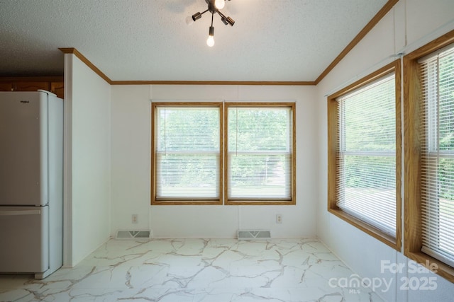 3823 Silver Creek Ter, Morganton, NC 28655 - unfurnished dining area featuring light marble finish flooring, crown molding, and a textured ceiling
