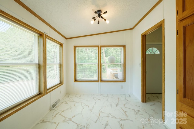3823 Silver Creek Ter, Morganton, NC 28655 - empty room featuring crown molding, healthy amount of natural light, light marble finish flooring, vaulted ceiling, and a textured ceiling