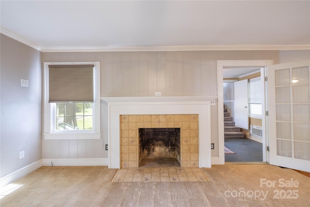 80 Pine St, Badin, NC 28009 - unfurnished living room with crown molding, carpet flooring, a tile fireplace, baseboards, and stairway