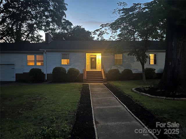 80 Pine St, Badin, NC 28009 - single story home with a lawn, a chimney, and a garage